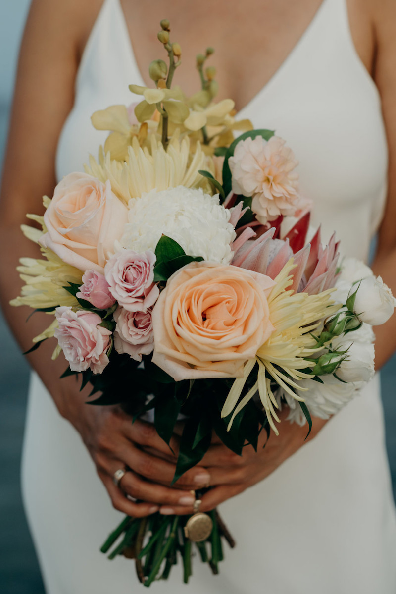 bride-with-colorful-tropical-protea-bouquet